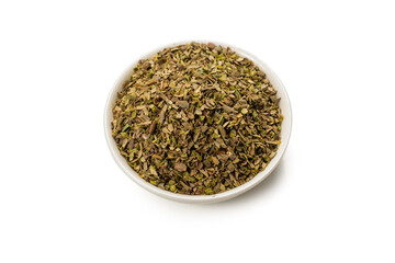 Oregano in a bowl isolated.