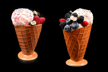 Ice cream with blueberries, blackberries and raspberries on a black background.  Copy space.