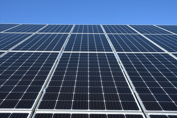 Solar panels against blue sky background.Against The Deep Blue Sky in suny weather