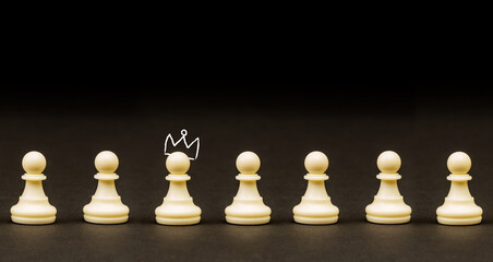 Brain and ideas can make different concept, Chess pawn with crown standing out from the crowd
