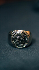 Santa Muerte ring  with bokeh background 