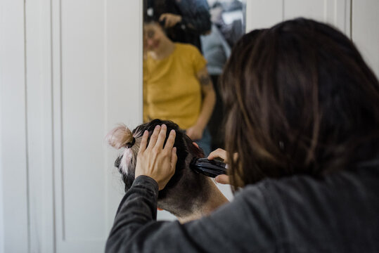 Woman getting hair buzzed off
