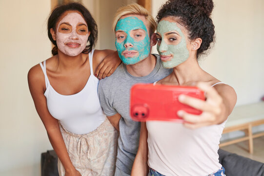 Friends taking spa day selfies