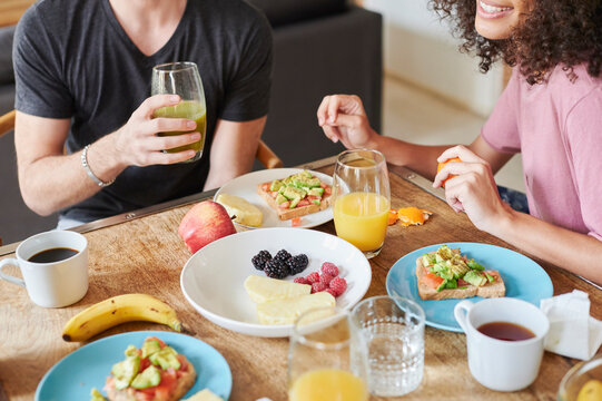 Friends enjoying a healthy breakfast - Powered by Adobe