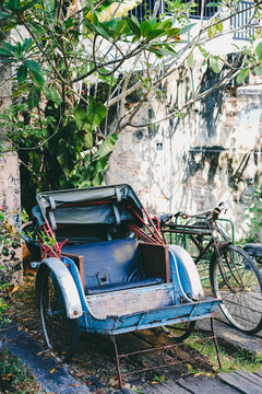 An old battered rickshaw