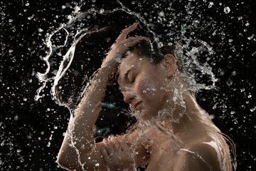  young woman with clean skin and splash of water Portrait of woman with drops of water around her...