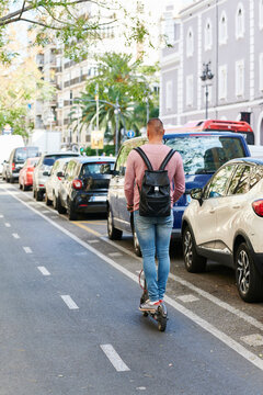 Man riding an e-scooter in the city