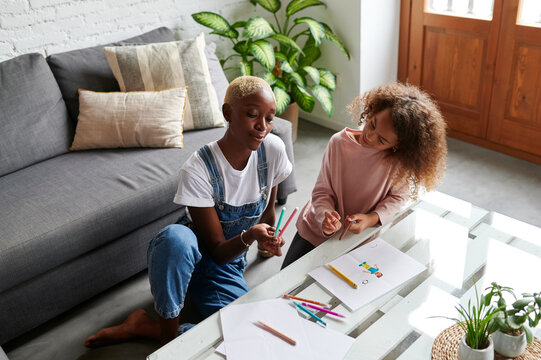 Mom And Daughter Coloring At Home