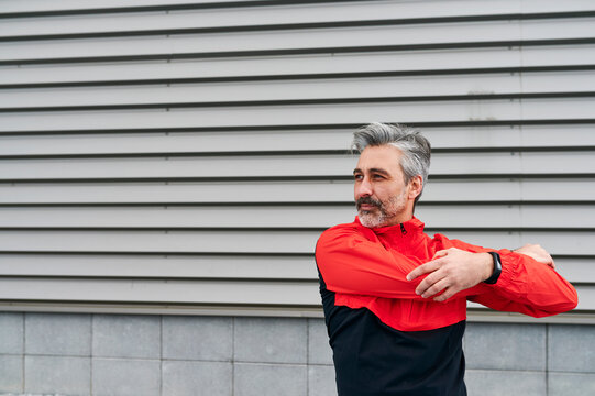 Man stretching before a city run