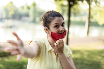 Smiling woman enjoy life at the park breathing fresh air after coronavirus outbreak - New normal...