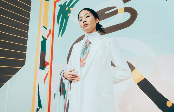 Fashion Model in colorful abstract space .