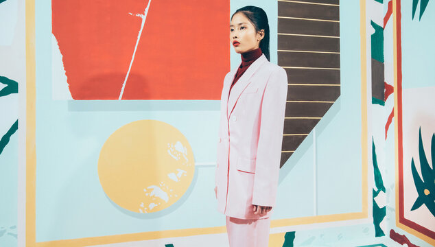 Fashion Model in colorful abstract space .