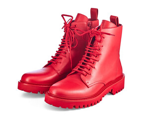 Beautiful pair of high red leather boots on lace and a massive sole with a rough tread, isolated on a white background with a shadow. Trend of the season: brightness and uniqueness of the image.