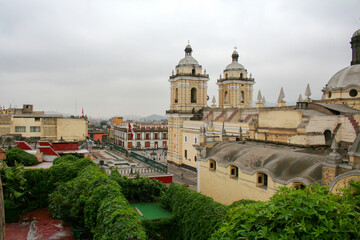 Fototapeta na wymiar Top view on roofs and heritage buildings of old Lima city center in cloudy day