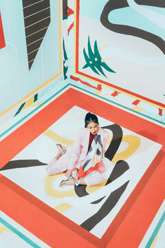 Fashion Model In Colorful Abstract Space .