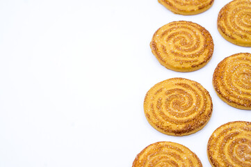 Round cookies sprinkled with sugar. Round cookies. Curled cookies with sugar.