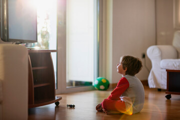 Five year old boy in front of a tv