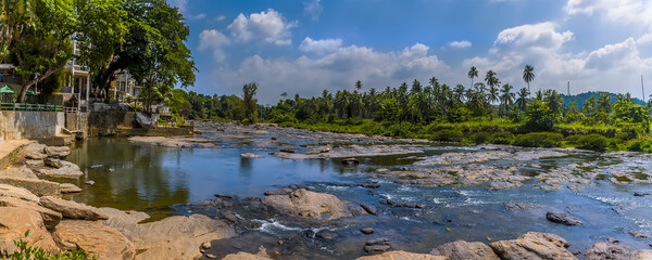 A panorama view across the Maha Oya river at Pinnawala, Sri Lanka, Asia