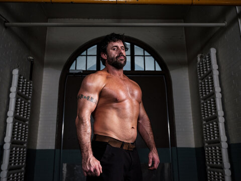 Muscular middle-aged man shirtless - Powered by Adobe