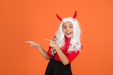 wanna have fun. childhood happiness. teen girl ready to celebrate costume party. funny red imp...