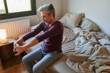 Mture man stretching in the morning