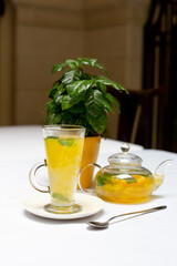 Teapot with orange tea sea ​​buckthorn cup of tea