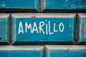 Yellow word on blue tile
