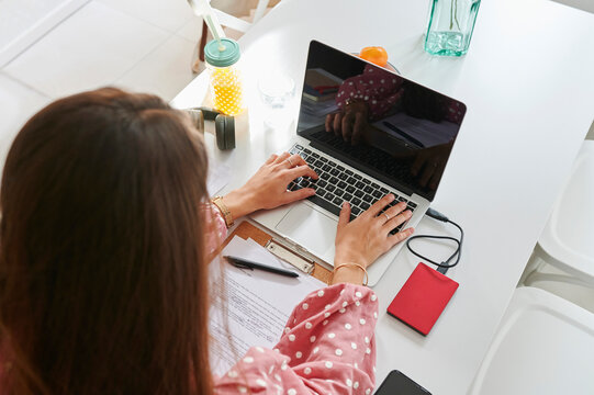 Woman using a laptop at home