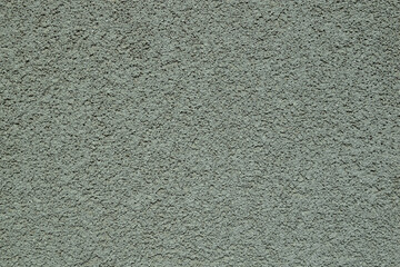 gray concrete wall, plastered with marble chips