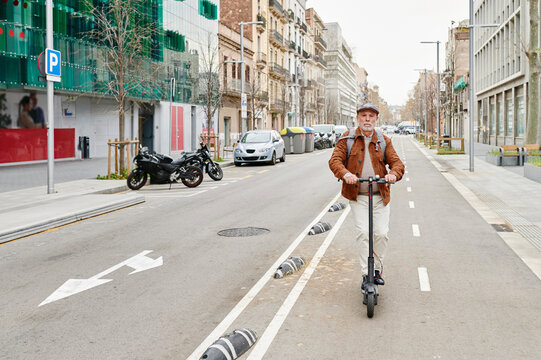 Senior man riding an electric scooter