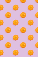 Bright pattern of fresh whole tangerines on a purple background. Citrus, vitamin C, fruit.