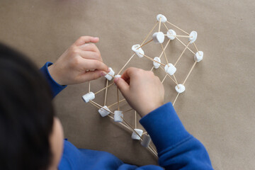 Little kid doing STEM project