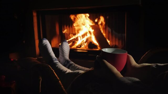 Relax with a cup of tea by the fireplace. Winter escape from all problems