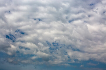 Fototapeta na wymiar Cloudscape with white clouds against blue sky