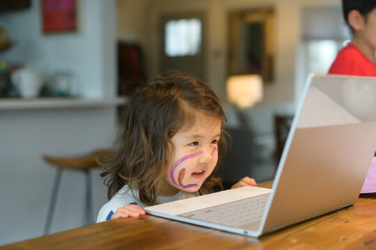 Little kid looking at computer