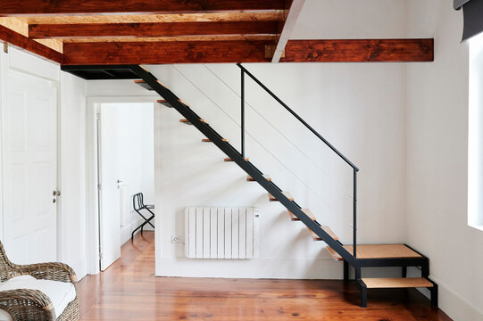 Wood staircase inside guesthouse room