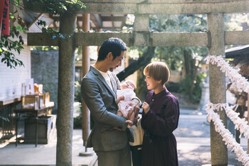 Traditional Japanese newborn celebration at shrine.