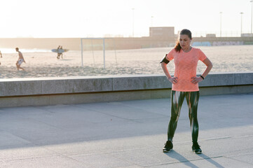 Fit mature woman looking tired after a run