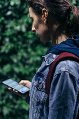 Woman looking at the map in the smartphone application