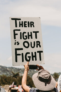 Protester holding sign