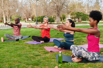 People practicing yoga outdoors