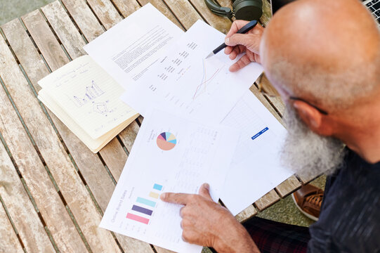 Man going over paperwork outside
