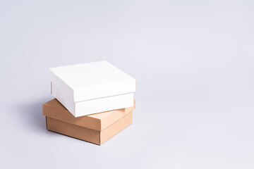 Set of white and brown carton cardboard boxes, copy space on grey background