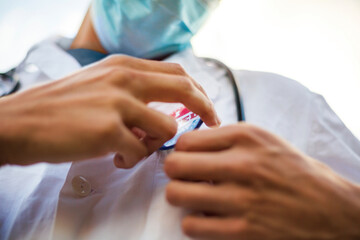 Doctor with I voted today badge on his uniform.