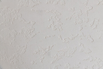 Abstract textured background. Close up view of concrete wall  covered with gray plaster. Copy space for your text.