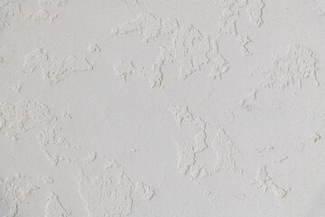 Abstract textured background. Close up view of concrete wall  covered with gray plaster. Copy space for your text.