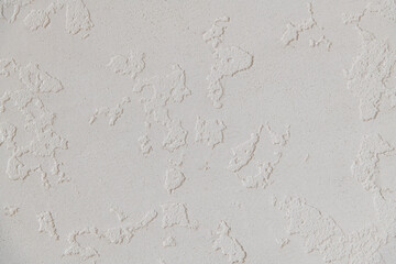 Abstract textured background. Close up view of concrete wall  covered with gray plaster. Copy space for your text.