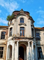 ZHELUDOK, BELARUS - SEPTEMBER 12, 2020: The abandoned manor of Svyatopolk-Chetvertinsky, built in the early 20th century. Popular tourist attraction in Belarus - 384870822