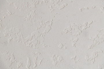 Abstract textured background. Close up view of concrete wall  covered with gray plaster. Copy space for your text.