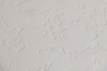 Abstract textured background. Close up view of concrete wall  covered with gray plaster. Copy space for your text.